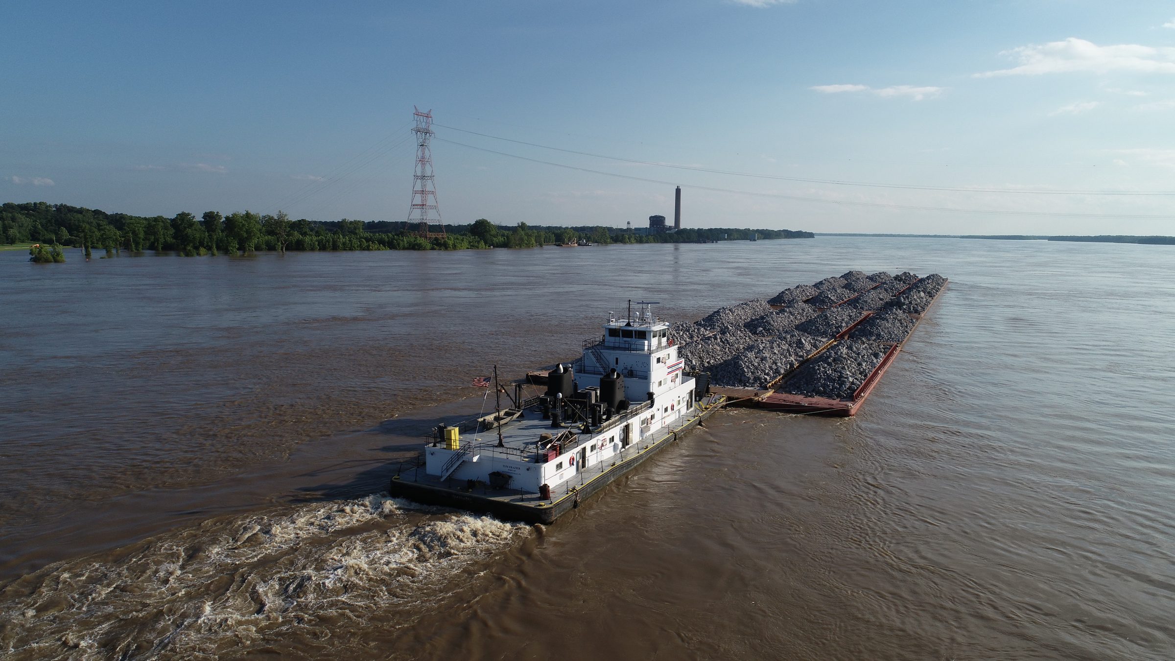 Barges moving rock on the river