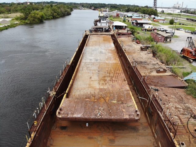 Aerial view of a Daulton barge on the river