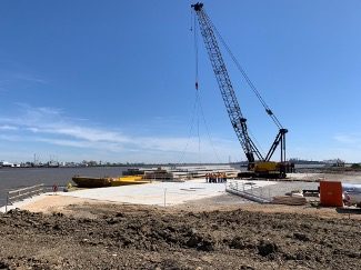 Crane barge working a project site