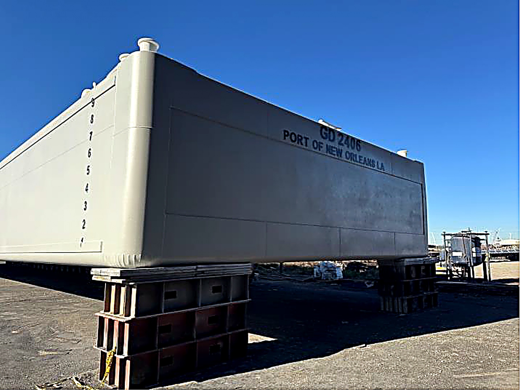 Barge GD 2406 of the Port of New Orleans, LA on blocks at the shipyard