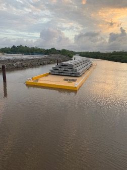 Loaded Daulton barge at sunset