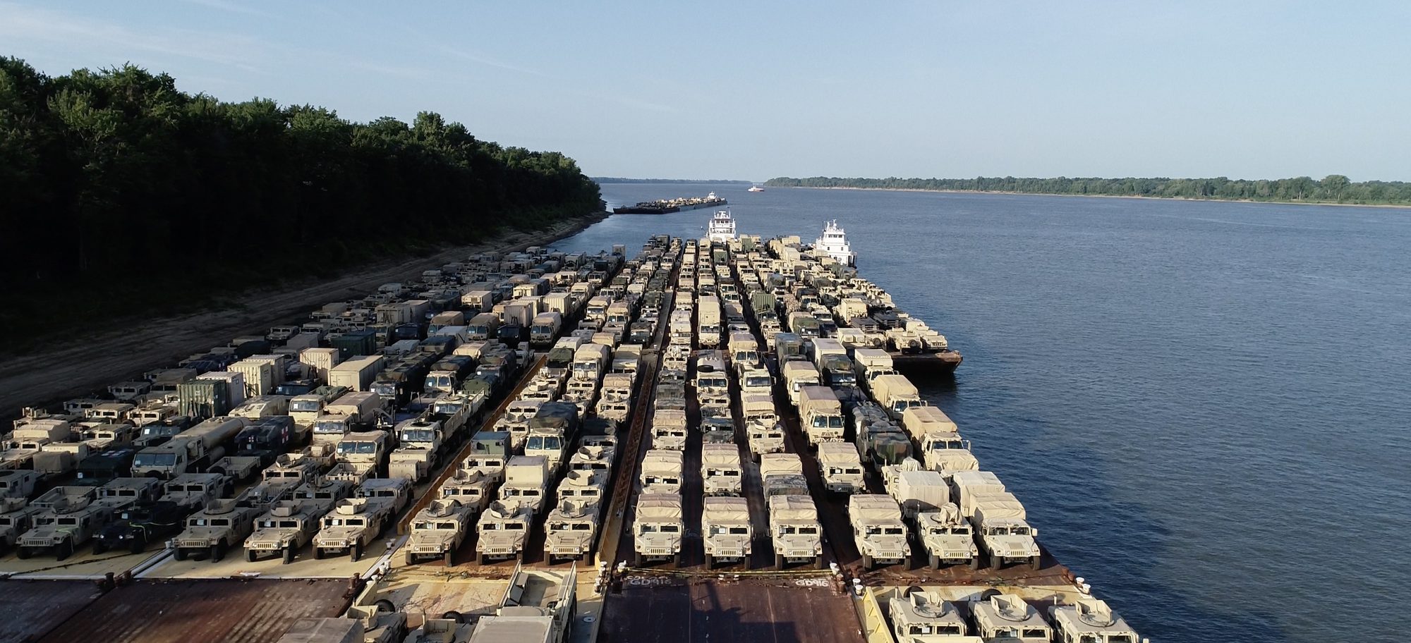 Military vehicles loaded on Daulton barges