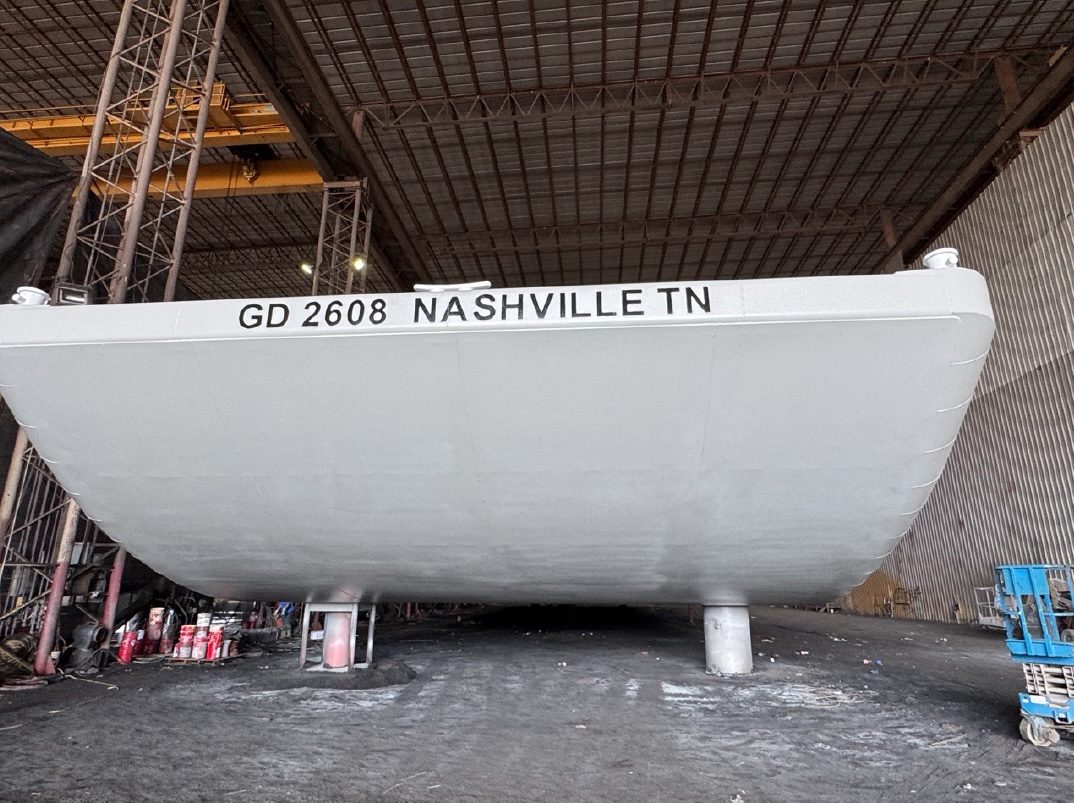 Side view of new-build barge GD 2608 in the fabrication shop